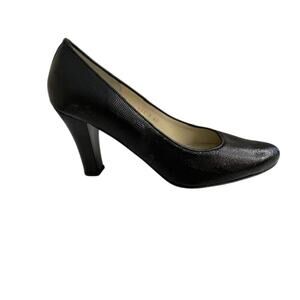Boucherel women's patent leather textured black dress shoes.